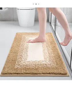 Fluffy gradient bath mat, absorbent plush floor rug for bathroom entrance and shower room.