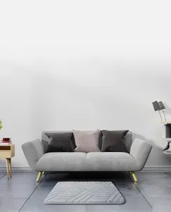 Grey geometric floor mat detail showing soft texture and modern living room decor style.