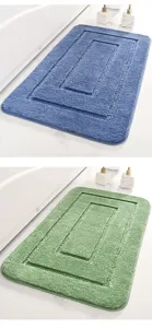 Detailed view of the microfiber rectangular bath mat in blue and green with raised square pattern.