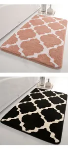 Detailed view of the soft absorbent bathroom mat featuring a chic geometric quatrefoil pattern.