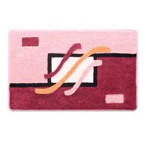 Modern pink flocking non-slip bathroom door mat, thick absorbent geometric carpet for home entrance.