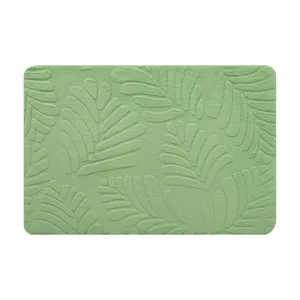 Thickened green memory foam bath mat with embossed leaf pattern, absorbent and anti-slip.