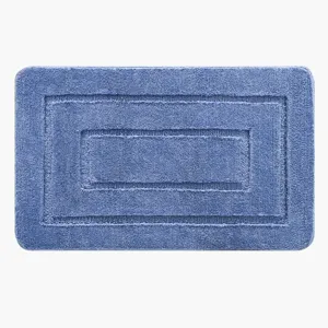 Blue microfiber bath mat, rectangular non-slip floor carpet for bathroom and restroom use.