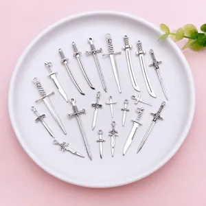 Antique silver sword dagger charms pendants DIY jewelry accessories detail close-up