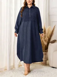 Details of dark blue plus size long sleeve dress with geometric embroidery and lapel.