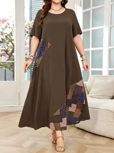 Detailed view of women plus size brown patchwork dress showing floral block design features.