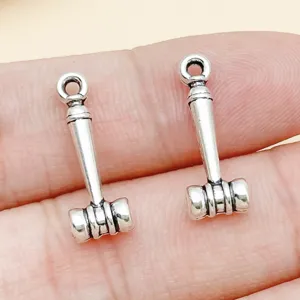 Detail shot of antique silver gavel metal charm pendant for DIY jewelry making and crafting.