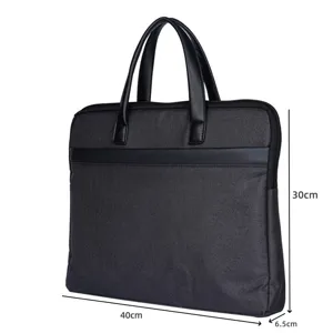 Borsa per laptop da lavoro resistente con doppi manici, design in tessuto e pelle.