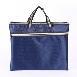 Blue oxford cloth document bag detail showing hexagonal pattern and dual zippers for daily office work.