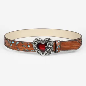 Detailed view of the vintage tooled leather belt with ornate heart buckle and floral carving.