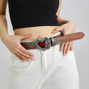 Retro bohemian embossed leather belt with statement silver heart buckle and turquoise details.