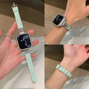 Detailed close-up view of the mint green leather and metal bow watch strap with rhinestone case.