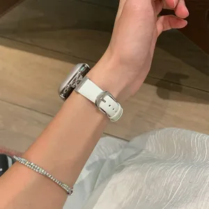 White leather watch strap with metallic bow design, elegant replacement band for smart watch.
