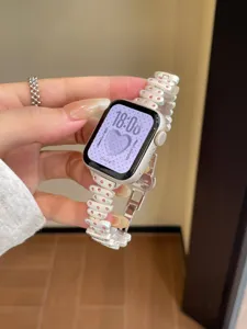 Replacement metal watch strap with pink rhinestones compatible with Apple smart watch.