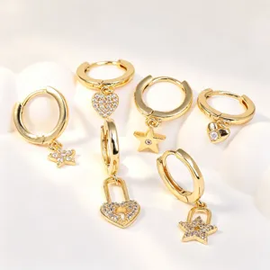 Gold-plated hoop earrings set with sparkling cubic zirconia star and heart lock charms.