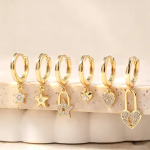 Gold hoop earrings set featuring sparkling zircon star and heart pendant charms for women.