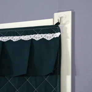Detailed view of thickened quilted door curtain with elegant white lace trim and hanging hook.