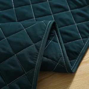 Thickened quilted winter door curtain detail, dark green thermal curtain fabric with diamond stitching.