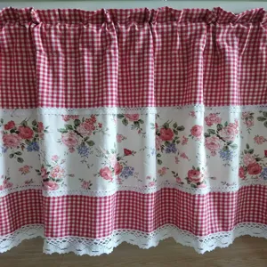 Detailed view of pastoral style short curtain with red plaid, floral print, and lace trim.