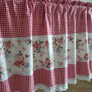 Pastoral style short curtain detail shot featuring red gingham and floral lace design.