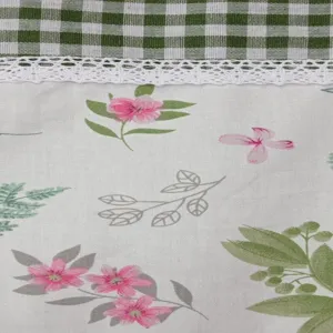 Rural style short curtain fabric detail with green gingham, white lace and floral print.