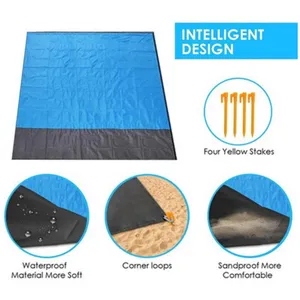 Waterproof outdoor picnic blanket beach mat with corner loops and four yellow stakes.