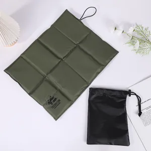 Compact folding camping seat cushion with storage bag, waterproof outdoor picnic mat for hiking.