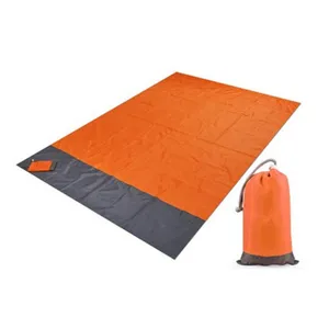 Waterproof outdoor picnic blanket, camping mat and beach ground sheet with portable storage bag
