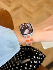 Bracelet de montre en silicone transparent à gros pois orange compatible Apple Watch.