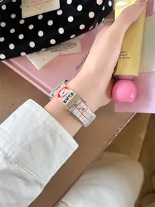 Silicone watch strap detail for Apple Watch, cute cartoon grid design, comfortable daily wear.