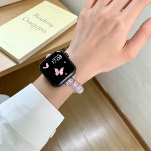 Cinturino per orologio rosa a spirale in filo telefonico con ciondolo fiocco per Apple Watch.