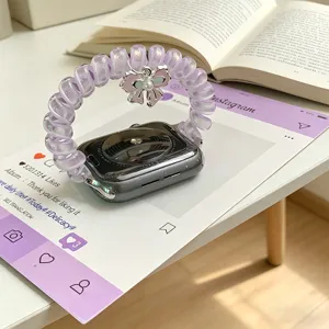 Cinturino per orologio a spirale viola con ciondolo a fiocco rosa compatibile Apple Watch.