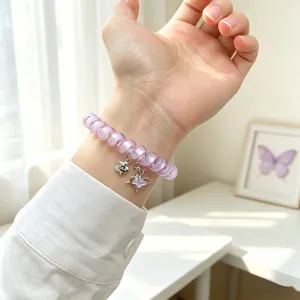 Bracelet de montre spirale violet avec un charm de papillon mignon pour Apple Watch