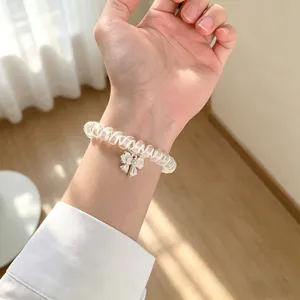 Cinturino per orologio trasparente a filo di telefono con grazioso fiocco per apple watch.