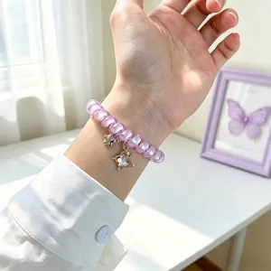 Bracelet de montre cordon téléphonique violet avec pendentif papillon pour Apple Watch.