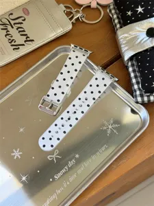 Silicone watch strap detail shot, black and white polka dot design, compatible with smart watch.