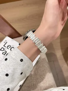 Replacement metal strap compatible with Apple watch, stylish irregular links wristband accessory.