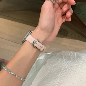 Pink leather watch strap compatible with smartwatches, featuring a sleek metal buckle design.