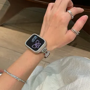 Detail shot of a rhinestone metal bow watch strap, elegant accessory compatible with Apple Watch.