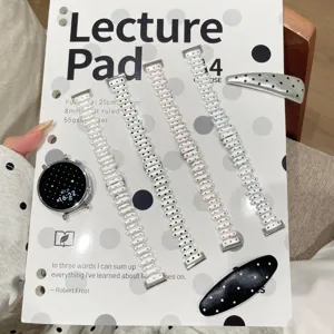 Metal watch strap compatible with Apple Watch, stylish polka dot rhinestone bracelet design.