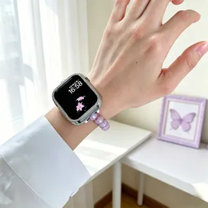 Boîtier de montre strass compatible et bracelet extensible perle mauve Apple Watch.