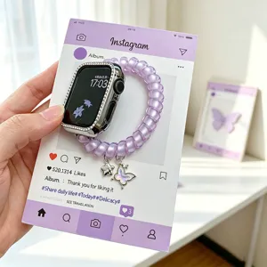 Bracelet de montre en fil téléphonique spiralé avec pendentif papillon pour Apple Watch élégant.