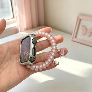 Bracelet montre Apple en fil telephone rose avec boitier strass, pendentif papillon et etoile.