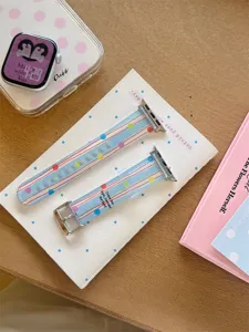 Colorful striped silicone watch band for Apple Watch, soft strap replacement with polka dots.