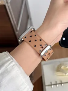 Detailed closeup of translucent brown TPU smartwatch strap featuring cute black heart pattern.