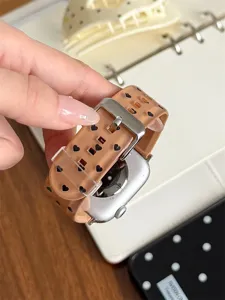 Close-up detail of TPU silicone watch band featuring cute black heart pattern and metal buckle.