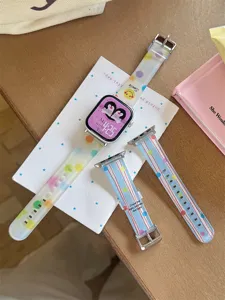 Silicone watch strap for Apple Watch with colorful dots and cute striped patterns detail view.