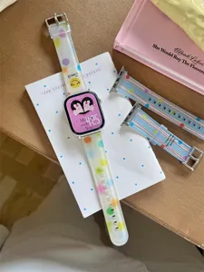 Detailed close-up of colorful dot and star patterned silicone watch strap for smart watch.