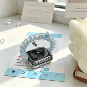 Bracelet de montre fil telefonique bleu avec pendentif papillon et étoile pour Apple Watch.
