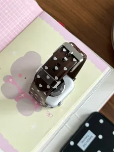 Close-up detail view of the brown heart pattern TPU silicone watch strap with metal buckle.